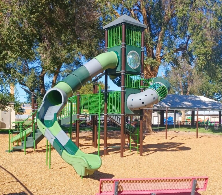 Green playground slides and climbing equipment Green playground slides and climbing equipment