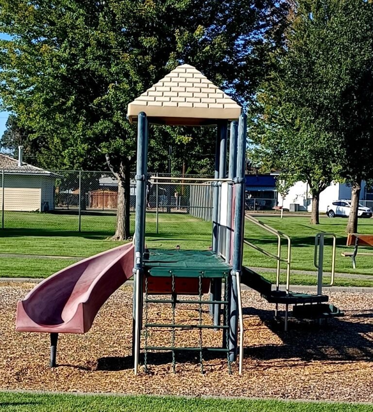 Small playground slide and playhouse at Richard Aguirre Park Small playground slide and playhouse at Richard Aguirre Park